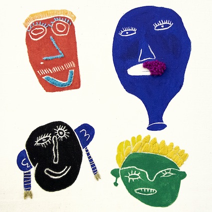An Embroidery and print of four colourful faces.
